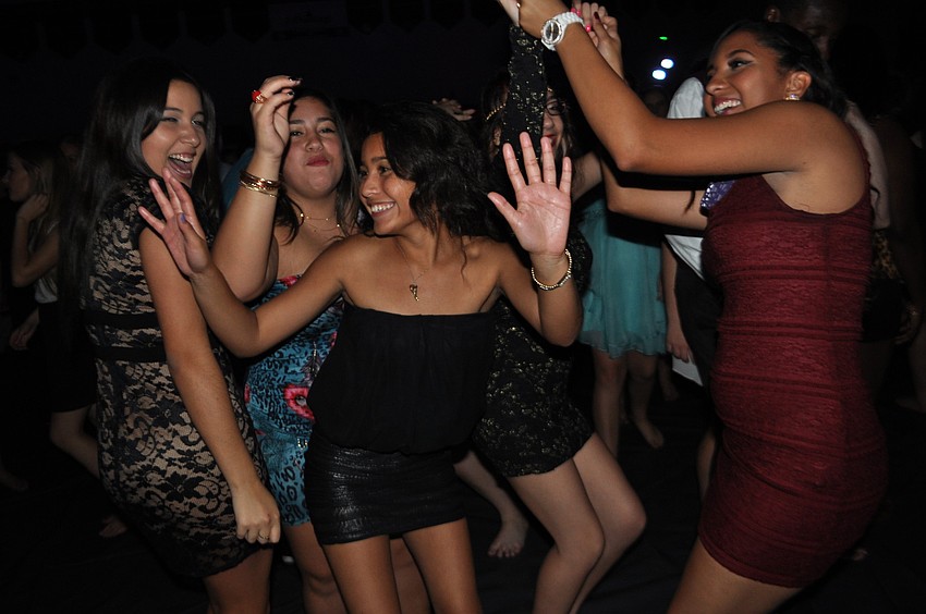 Mary Linares, center, dances with friends.