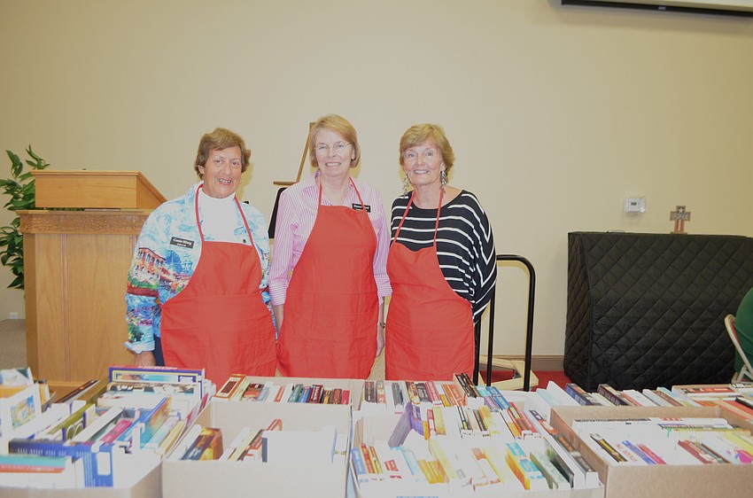 Connie Hilwig, Eleanor Cloud and Beverly Sutton sell books from the churchâ€™s library