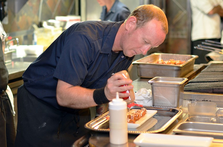 Chef Steve Phelps prepares the second course.