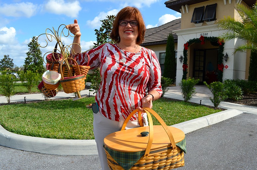 Diane Fierle brings in more baskets for sale.