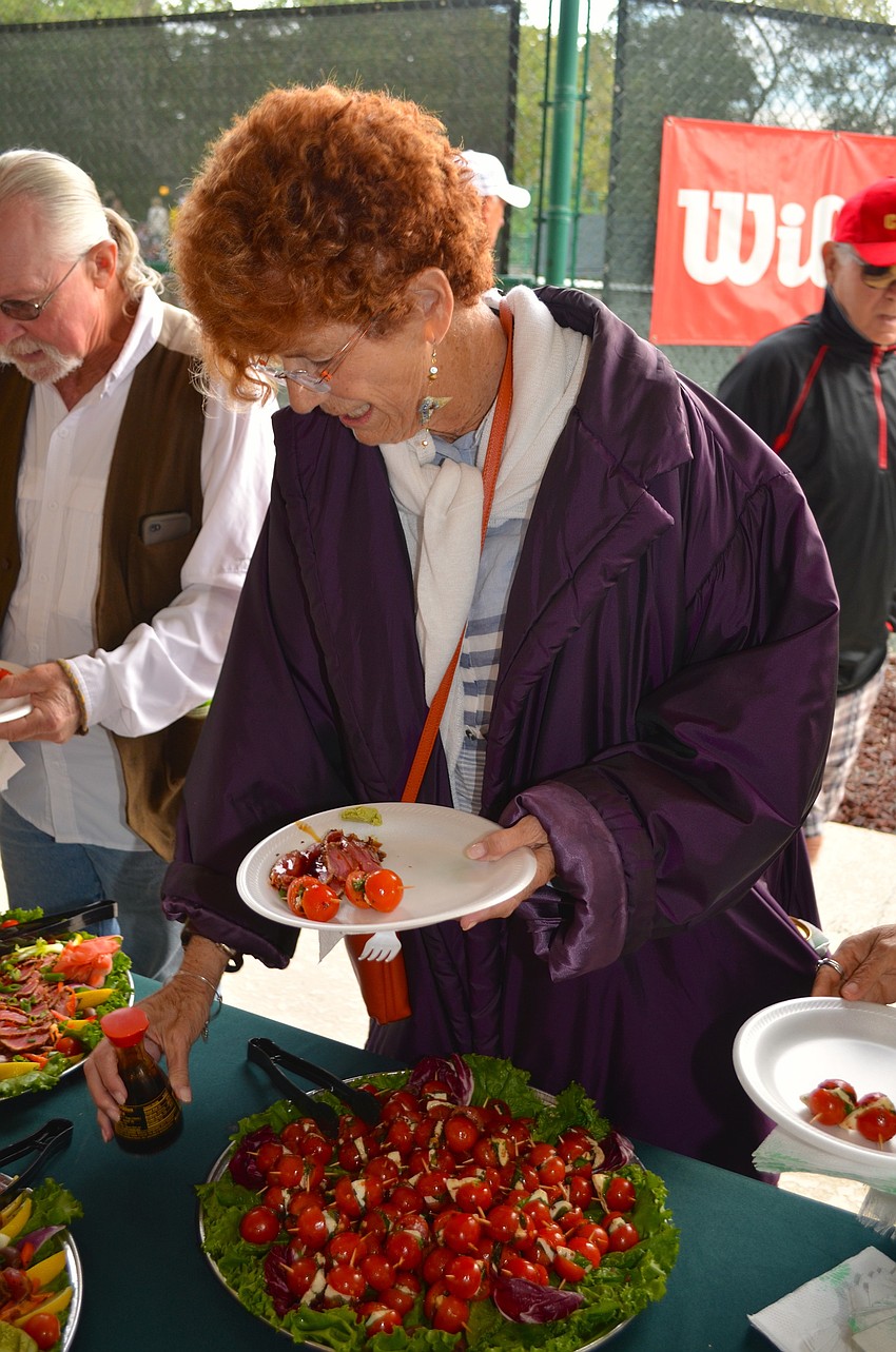 Nancy Kane enjoys the food spread by Harry's Continental Kitchens.