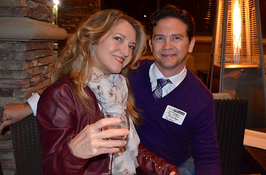 Stacey Darr and Ric Wetzel cozy up near the fire.