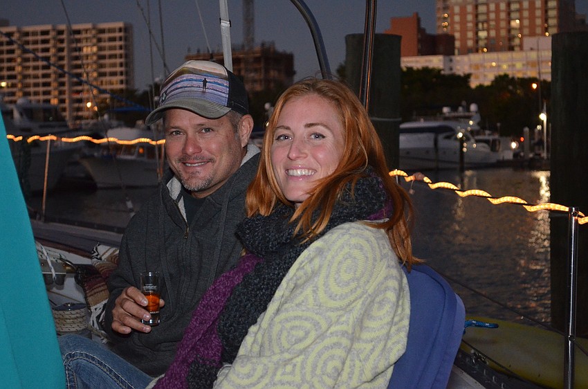 Robin Smith and Jerah Coviello watch the boat parade from their boat docked at Bayfront Park.