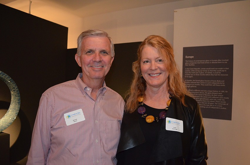Michael Moore, vice president for advancement of Ringling College, and glass artist Leslie Genninger