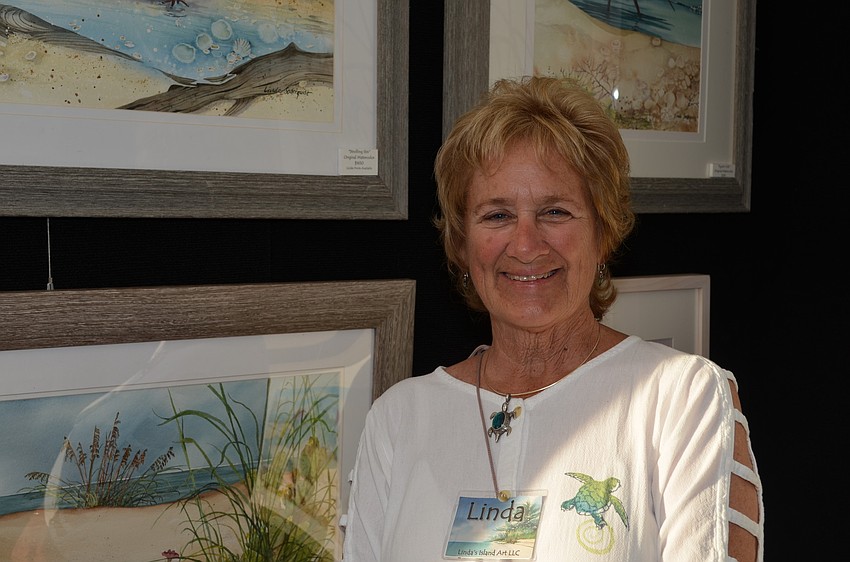Linda Soderquist with her booth.