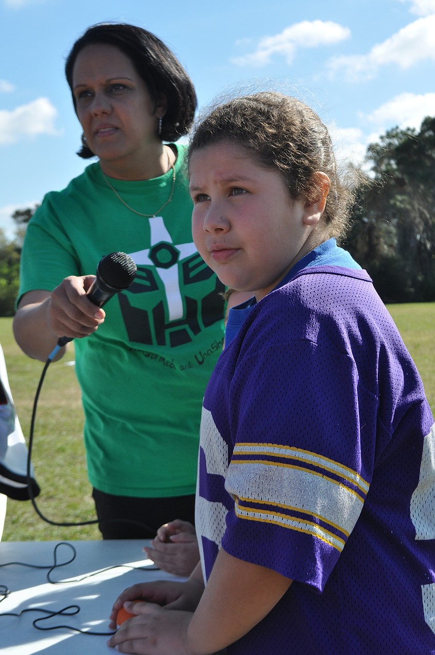 Danielle Motta, 7, answers a question about Moses correctly.