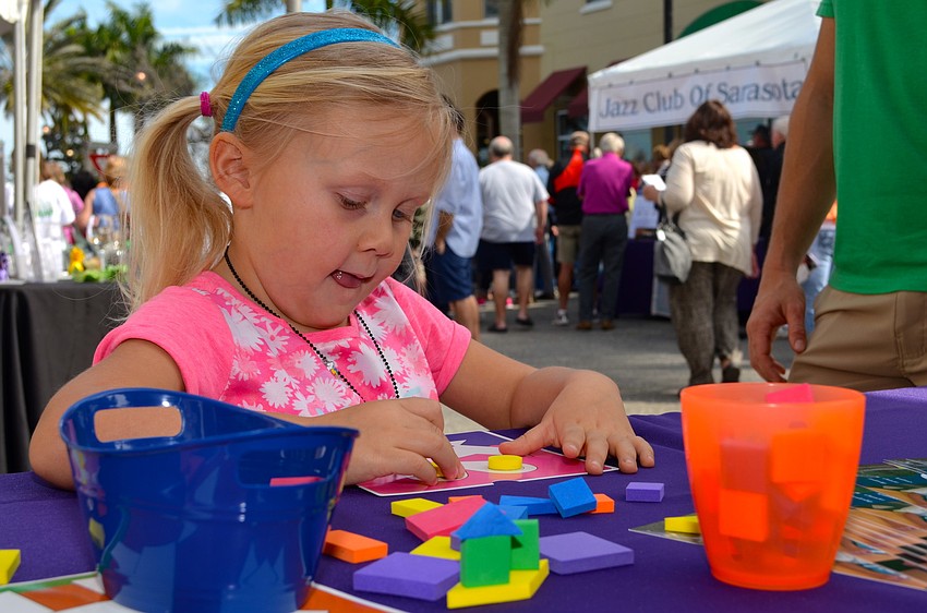 Four-year-old Kayden Holt works on a craft project.