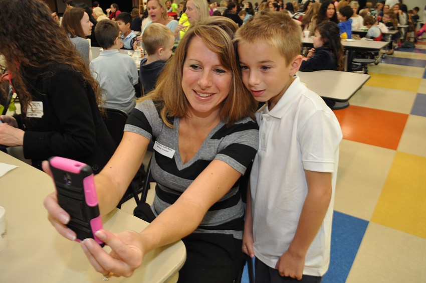 Valerie Nichols makes sure to capture the moment with her son, Ryan.
