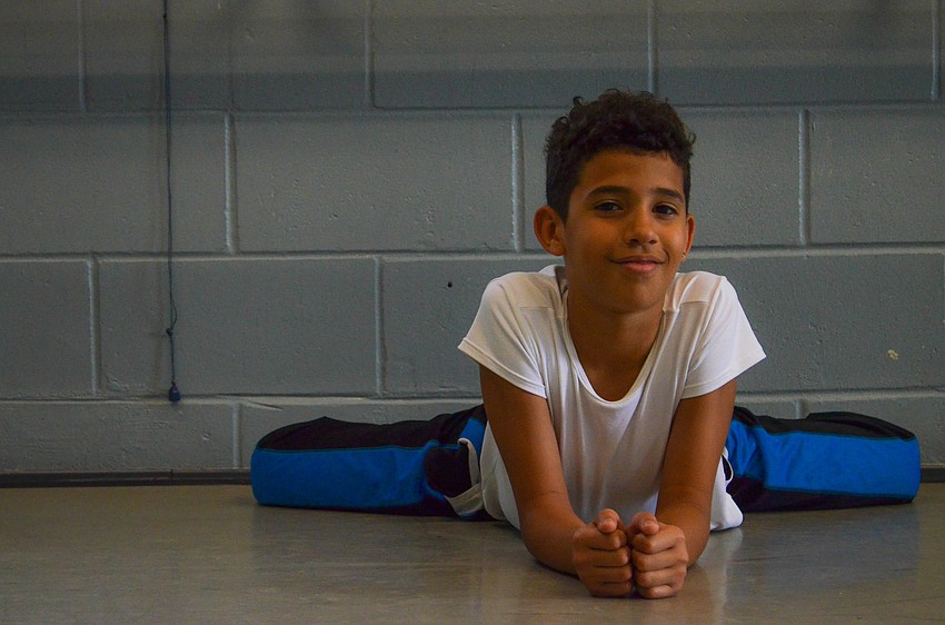 Flexibility comes naturally to Tony Rutland, who stretches before a Sarasota Ballet School rehearsal