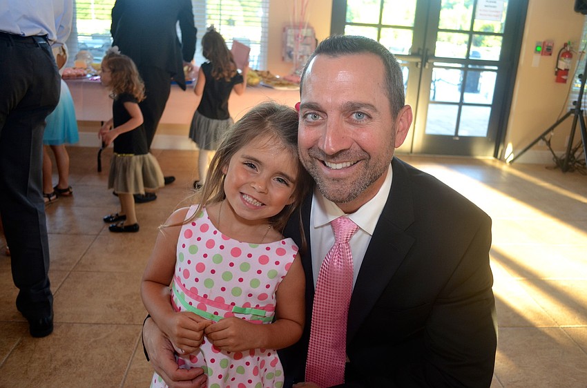 Chloe Tullio and her father, Mike, are all smiles in pink.