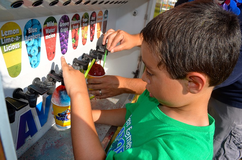 Mason McGeehan creates a custom flavored snow cone.