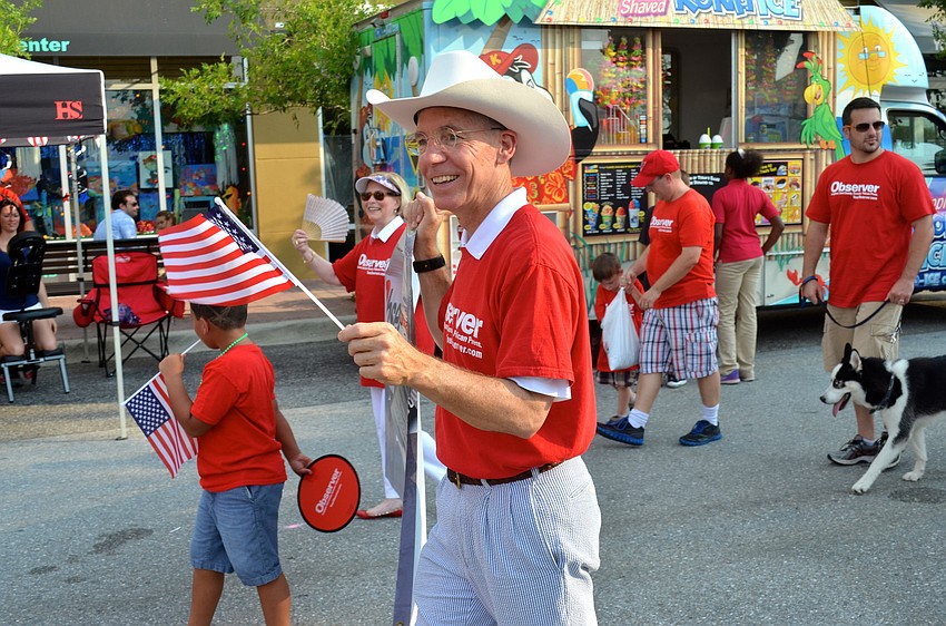 The Observer Media Group CEO Matt Walsh shows his patriotism, waving his American flag.