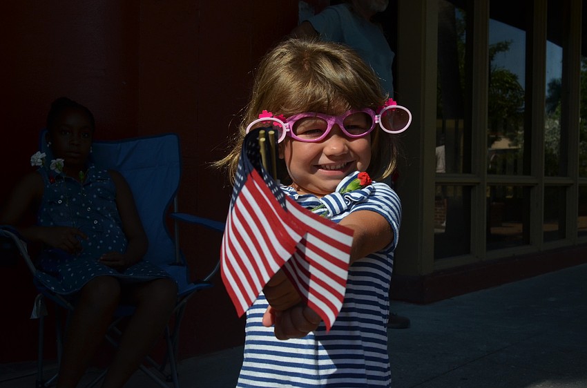 Olivia Guido waves her flags.