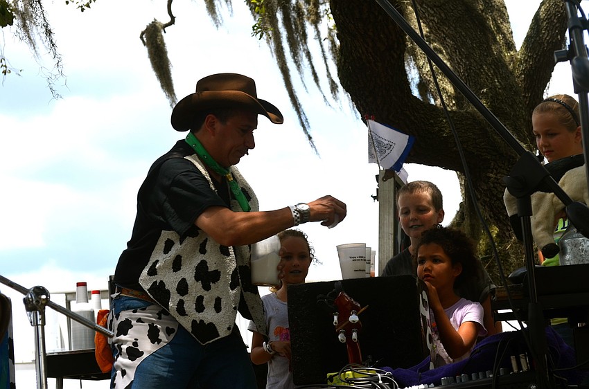 The festival's Moogician performs dairy-themed magic tricks for participants.