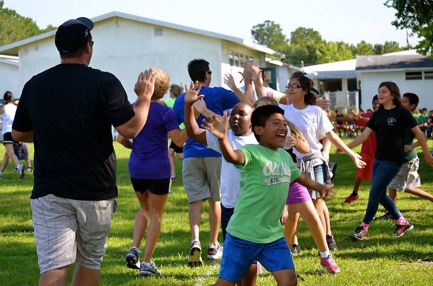 After a close game, the participants slap hands.