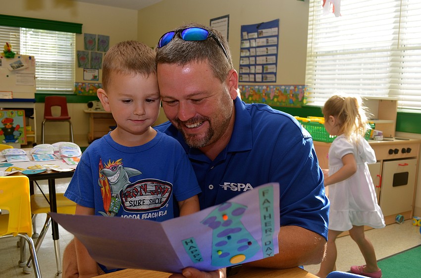 Cooper Mulder gives his father, Mark, his Father's Day gift.