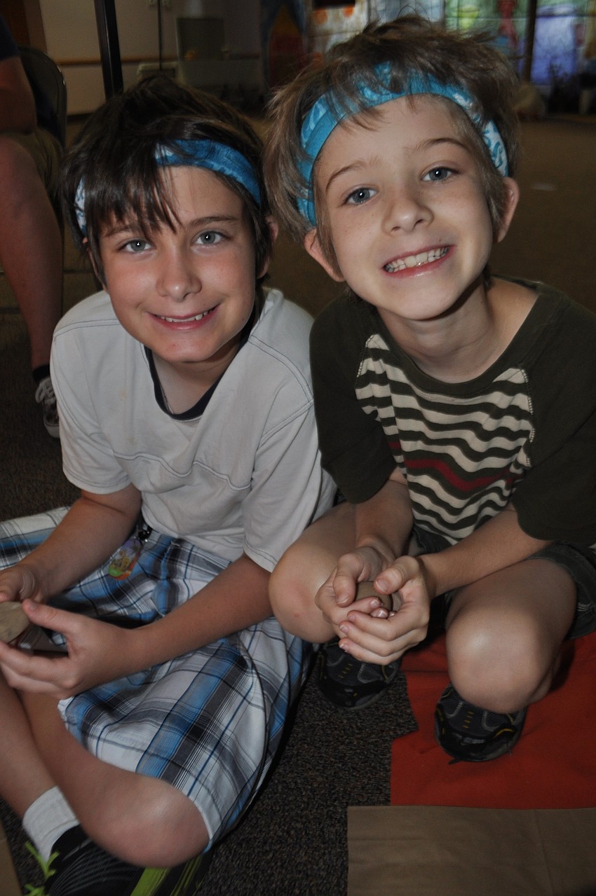 Brothers Kyle and Tyler Silver sit next to each other at craft time.