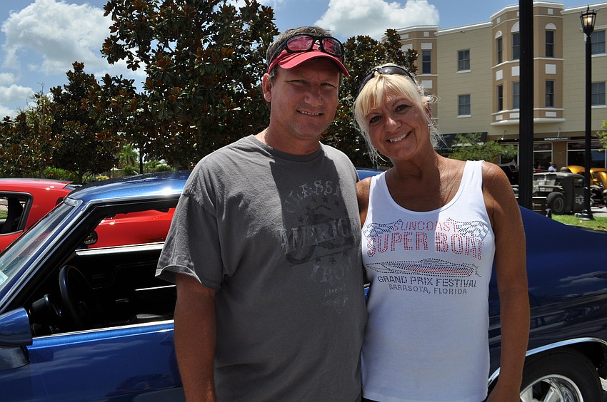 Richard Davis looks at cars with festival director Lucy Nicandri.