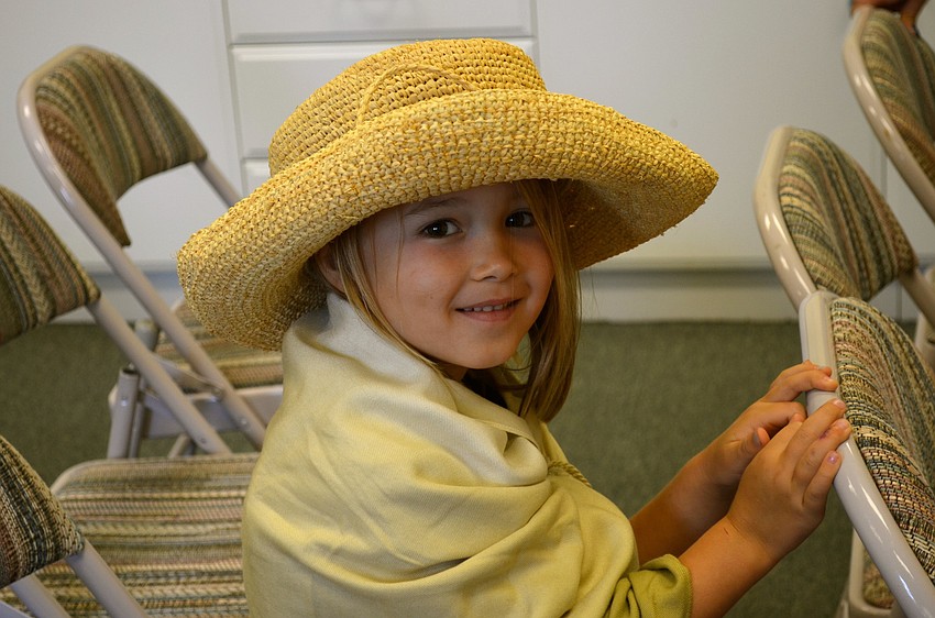 Cora Wells plays dress up.