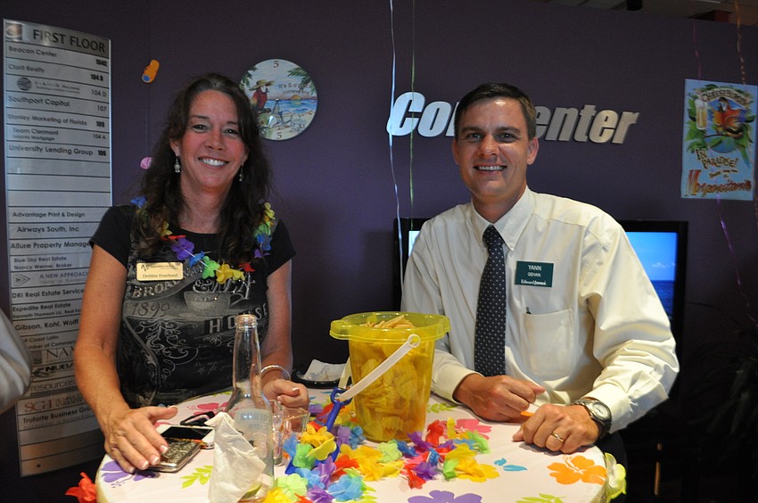 Debbie Fruehauf, of Windstream, chats over appetizers with Yann Gehan, of Edward Jones.