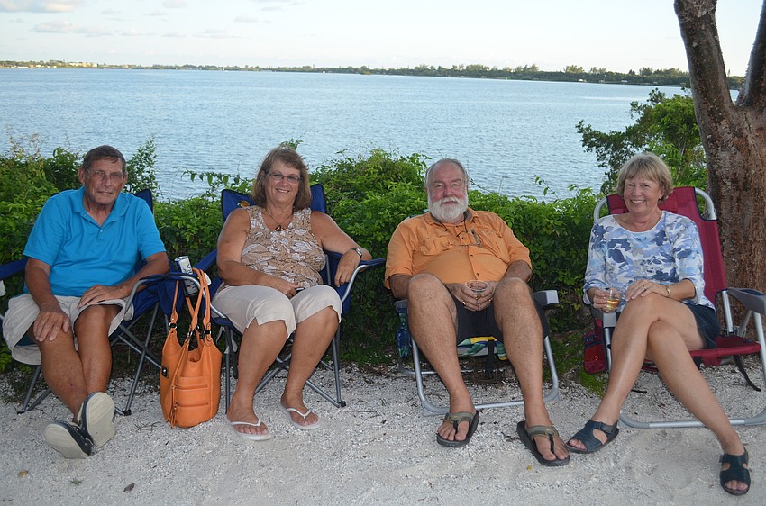 Bob and Sandra Sisum sit with Ted and Marilyn Goodwin by the water.