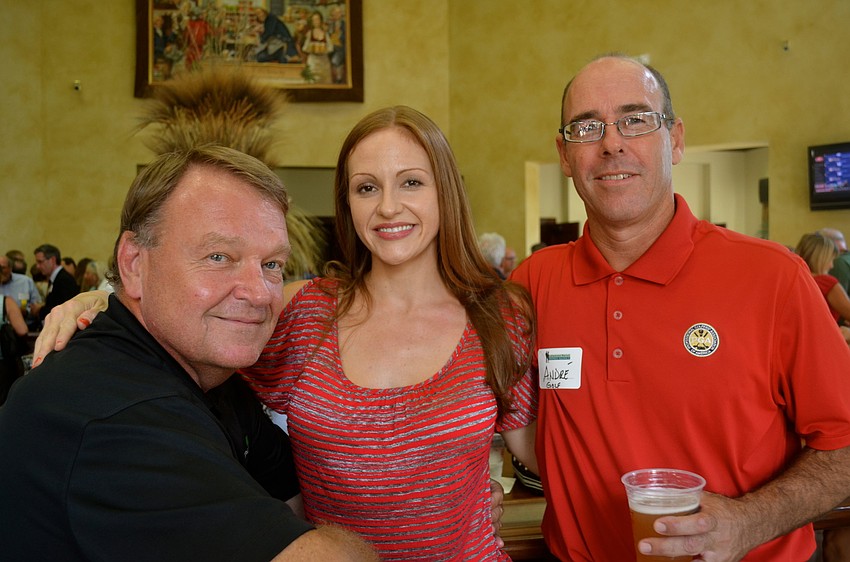 Father and daughter duo Pat and Megan Keever pose with Andre Panet-Raymond.