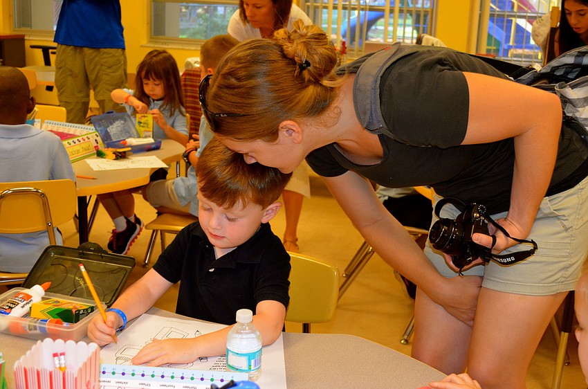 Liam Shevlin and his mother, Ashley, share a few words before leaving each other for the day.