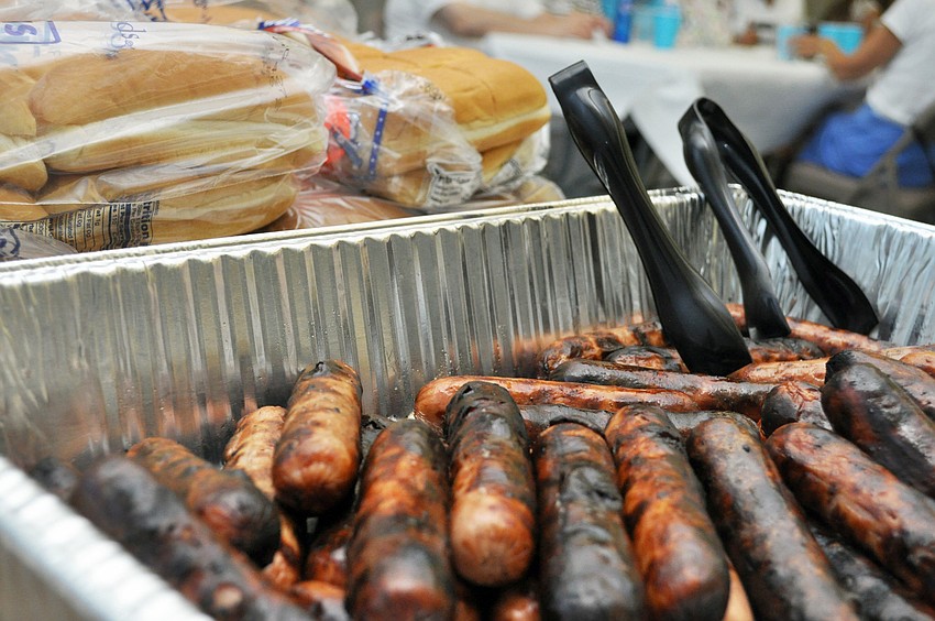 Grilled hot dogs and fixings were served at St. Mary Menâ€™s Clubâ€™s Hot Dog Cookout Thursday, Aug. 21.