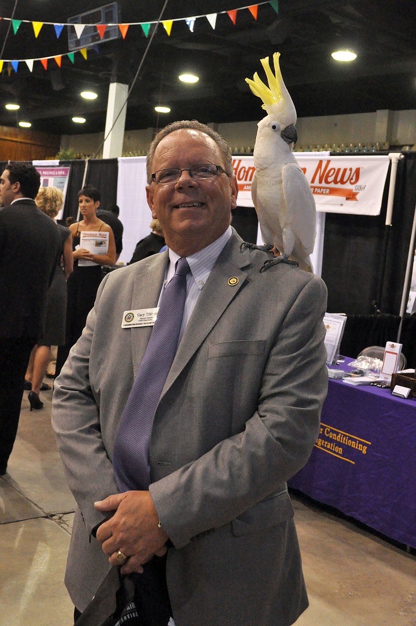Gary Tibbetts with Kelly, a sulphur-crested cockatoo from Save Our Seabirds