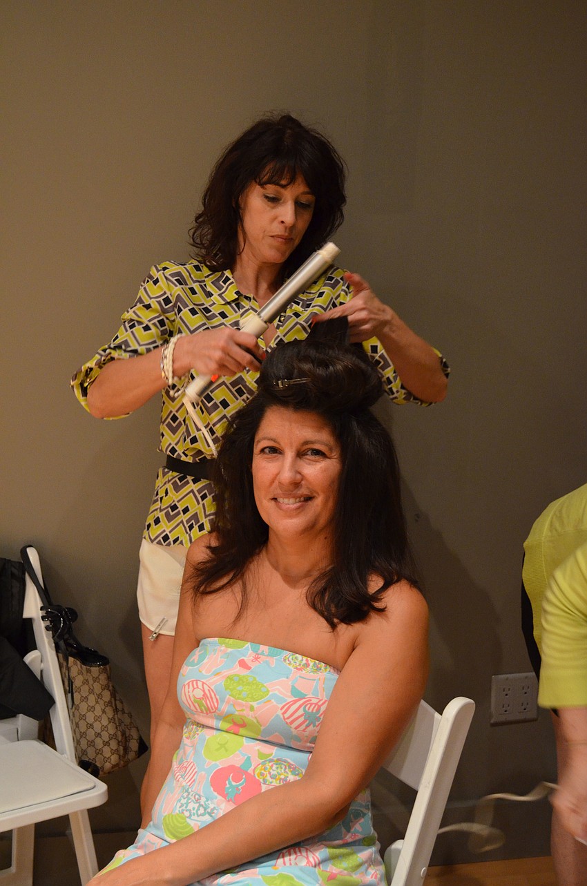 Angelaâ€™s Pure Salon & Spa owner Angela Powers demonstrates hair and make up tips on Jackie Savighe.
