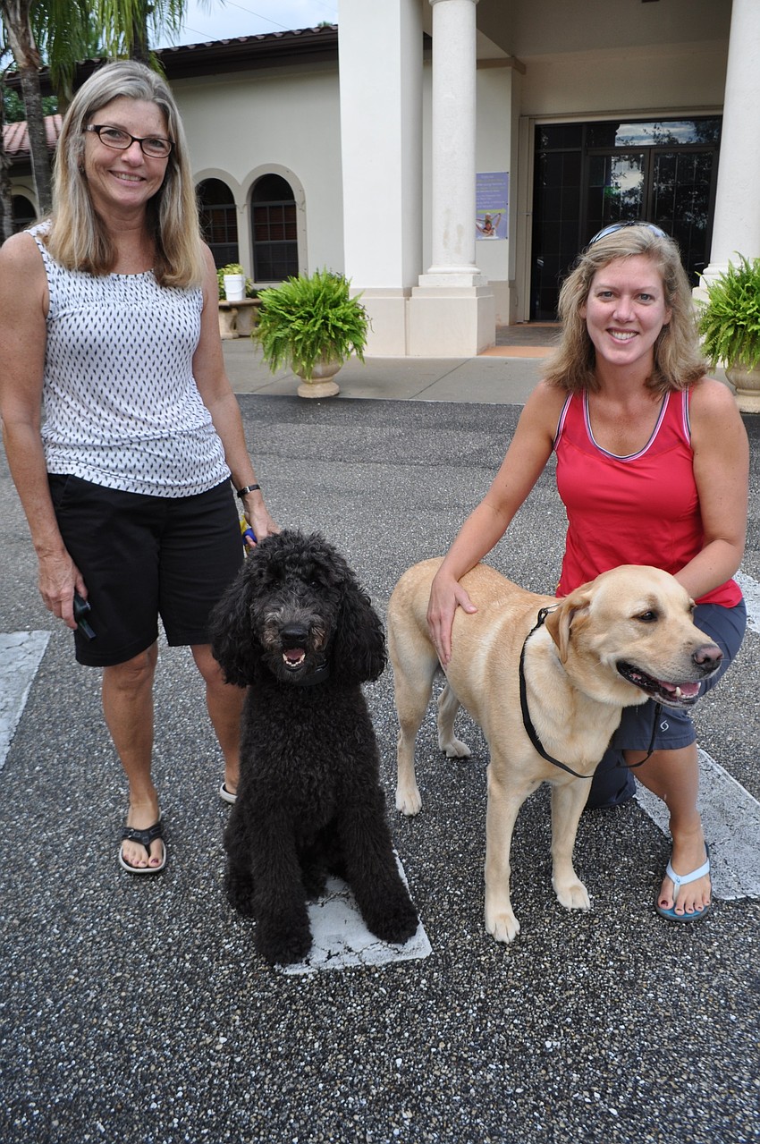 Fran Jack, with Lexi, and Lora Rees, with Turner, are neighbors in Greenbrook.