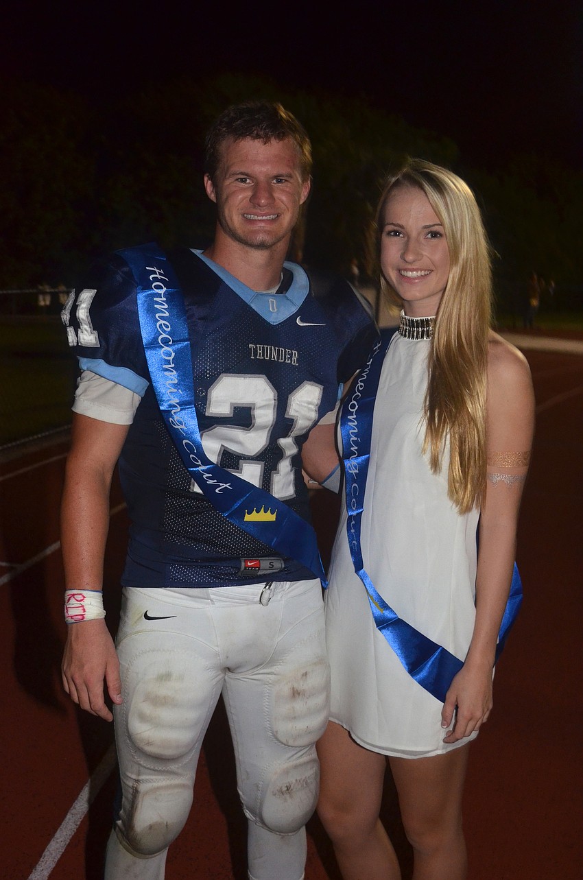 Seniors and homecoming king and queen Austin Hoppe and Natalie Buffett prepare to walk with the homecoming court.