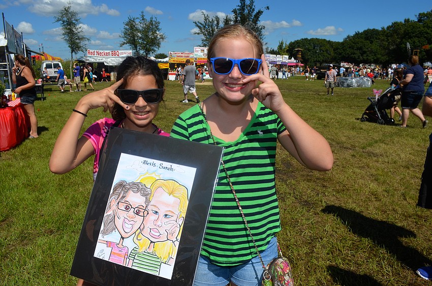 Alexis Roper and Sarah Bryant reenact their caricature poses.