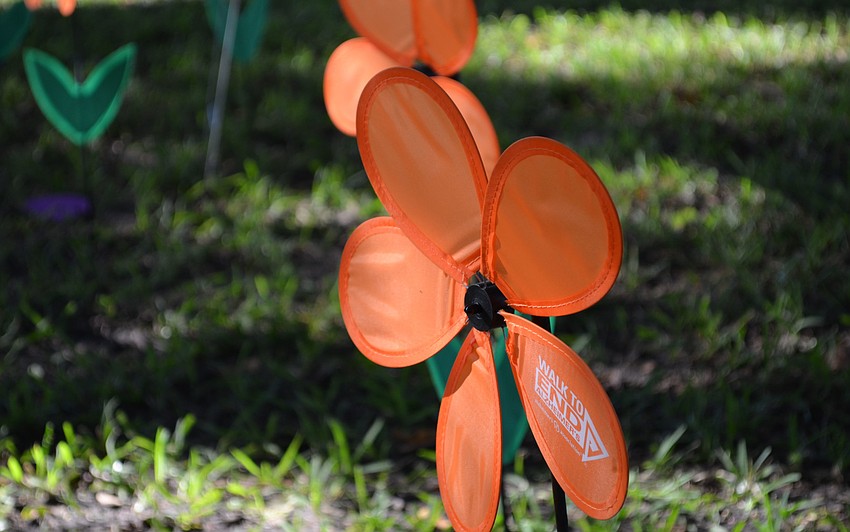 Walkers carried flowers with different colors and meanings. Orange flowers represent someone walking for a world without Alzheimerâ€™s.