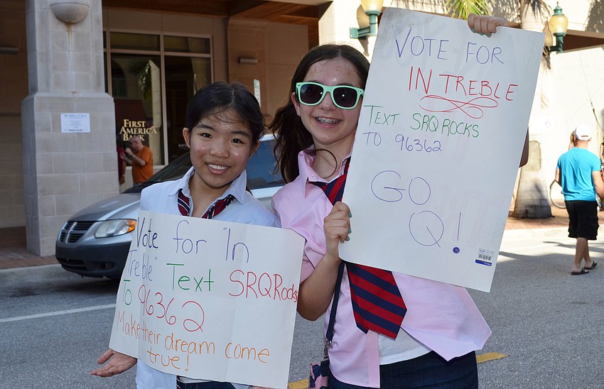 Sayo Hayashi and Caroline Creevy of the group In Treble try to gather support for their band.