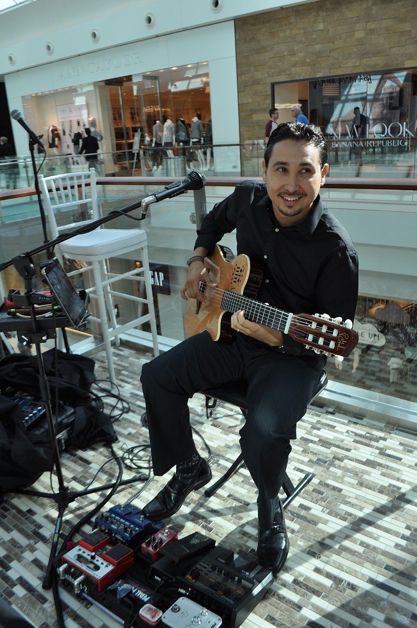Andres Colin performs from a spot on the second level.
