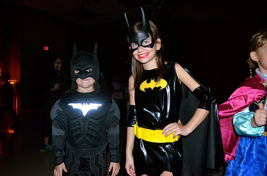 The bat pack â€” Lucas Love and Olivia Ellis â€” sport black plastic ensembles.