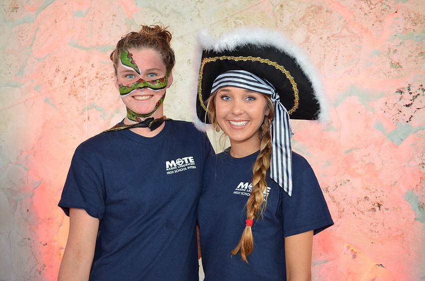 Mote High School interns Rachel Oâ€™Grady and Mallori Johnson help out at the Mote Night of Fish, Fun and Fright.