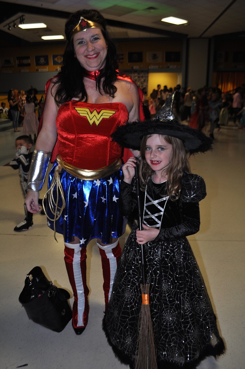 Cathy Adkins and her daughter, Teagan, both dress up.