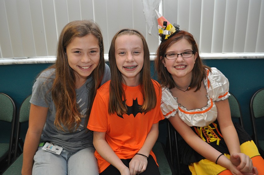 Alex Renda, Madison Cartano and Colleen Gilbride find a quiet spot to talk.
