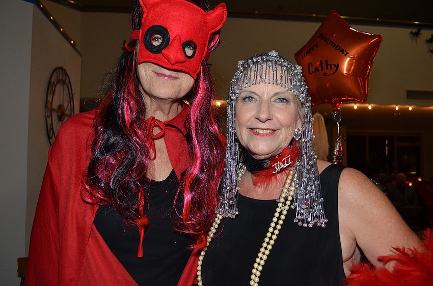 Angie Thompson and Roslyn Whitmar dressed as a she-devil and flapper for the party.