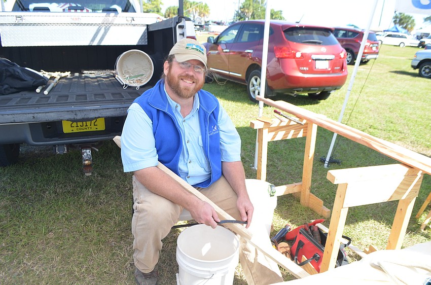 John Beale of the Florida Maritime Museum carving a paddle