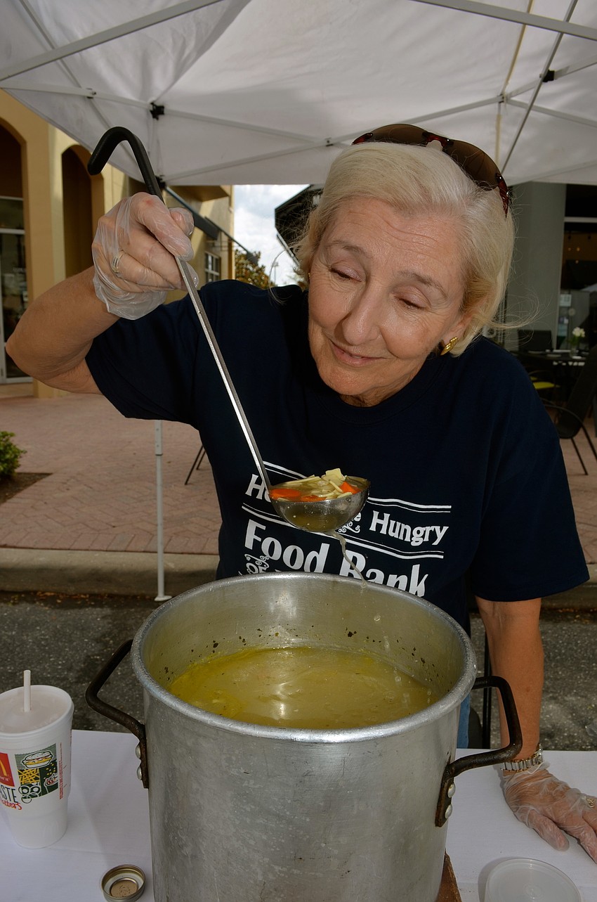 Pam Heindman serves chicken noodle soup.