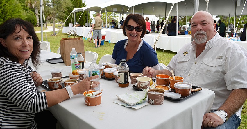 Gina Cirillo sits with Kandie and Tony Broussard at the Bowls of Hope event.