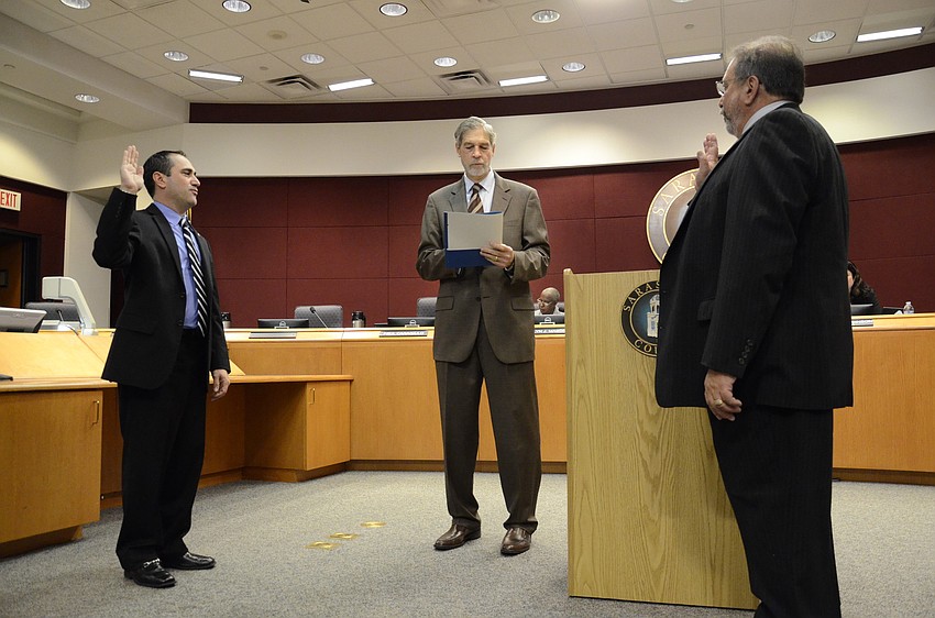 New Commissioners Paul Caragiulo and Alan Maio are sworn into their new positions by 12th Circuit Chief Judge Andrew D. Owens, Jr.