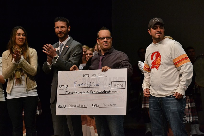 The band Seven Years Past donates their winnings from the battle of the bands at Rock for a Cause.