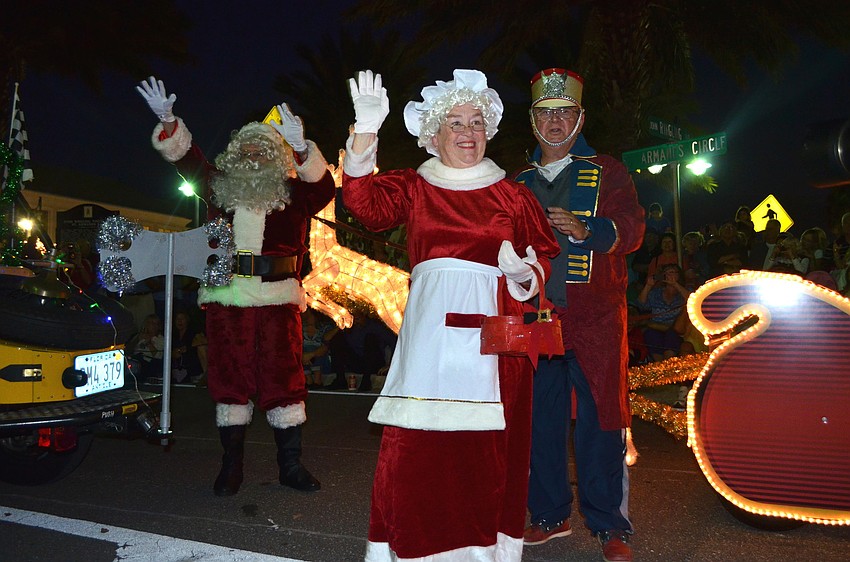 Santa and Mrs. Claus wave to the crowd.