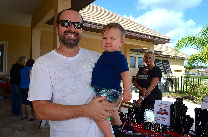 Cole Duncan and his son, Caleb, relax in the shade.