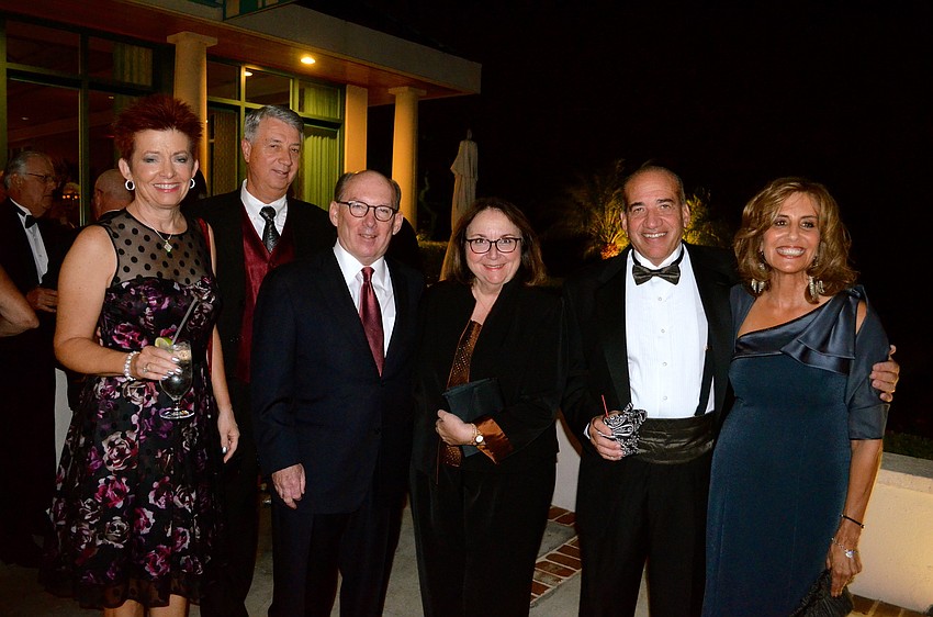 Jeanie and Dennis Blazey, Lynn and Maria Meredith and Gail and Fred Snyder chat with friends.