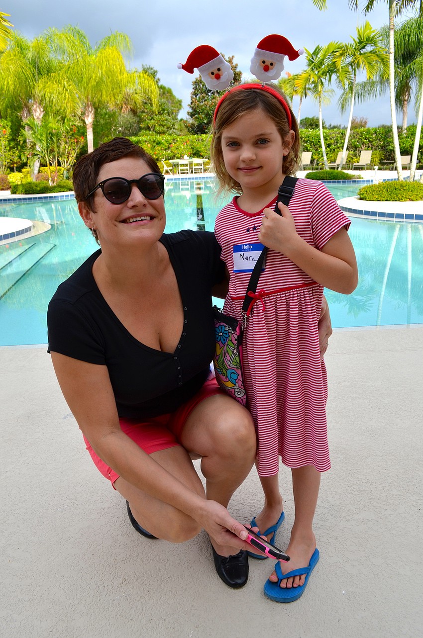 Becky Benninghoff and her daughter, Nora, enjoy a breezy afternoon outside.